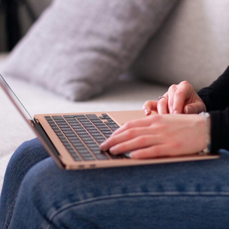 Someone typing on a laptop