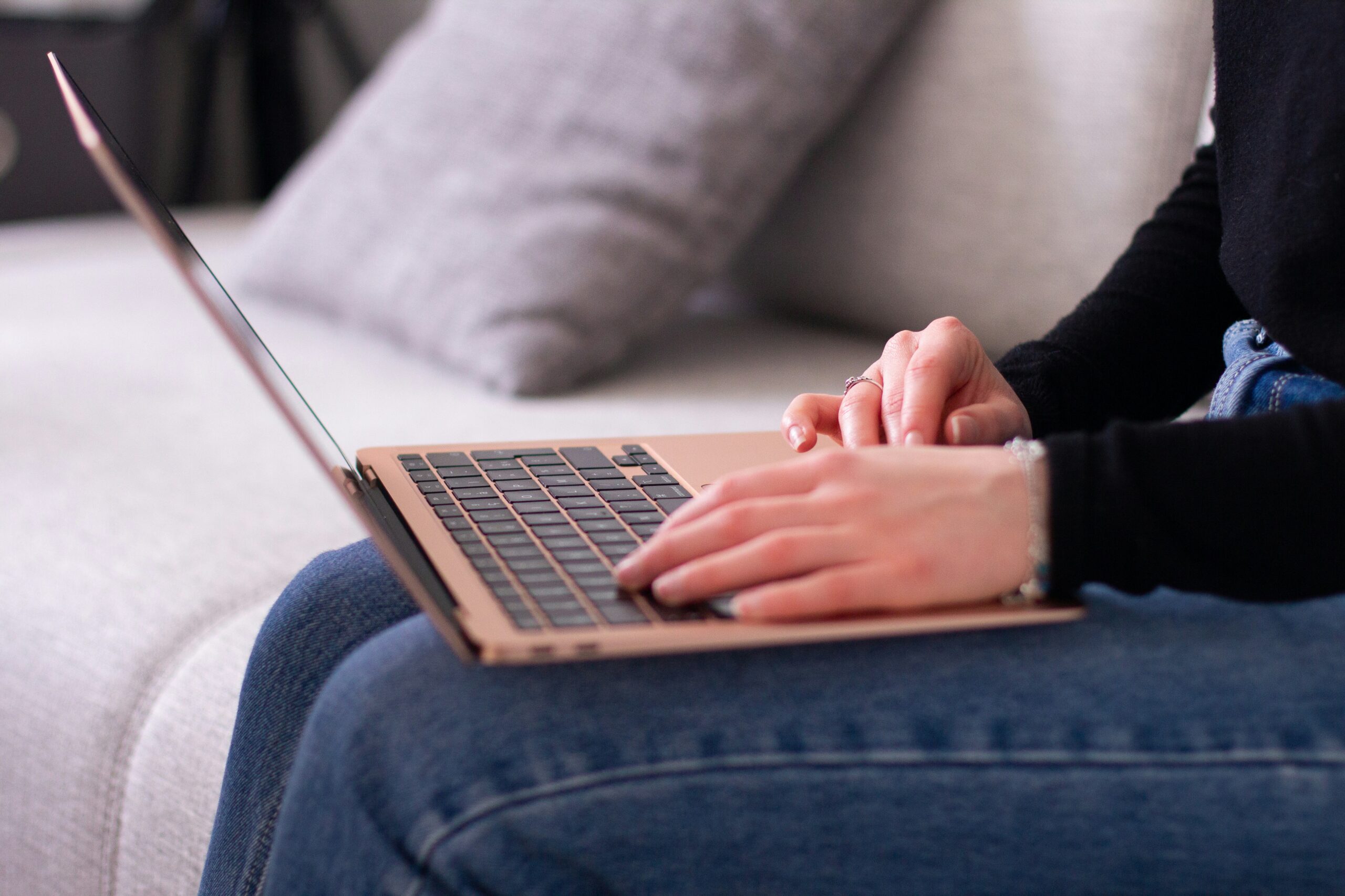 Someone typing on a laptop